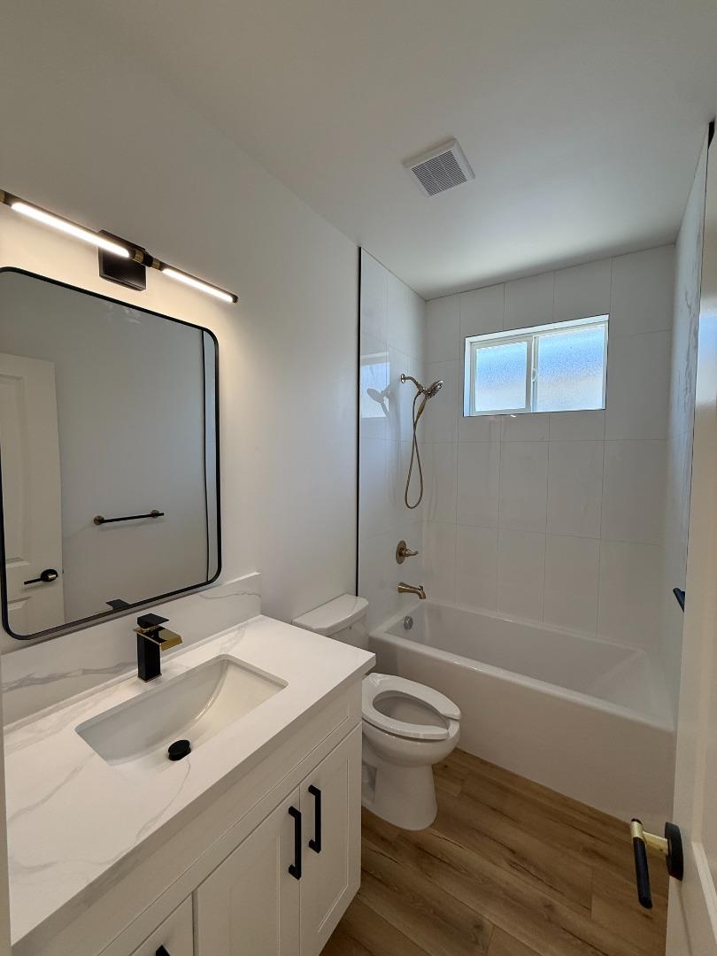963 Olive Br Place, Unit 959 Sacramento, CA 95815 - Photo 7 of 12 a bathroom with a sink toilet and shower