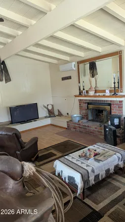 a bedroom with bed and window