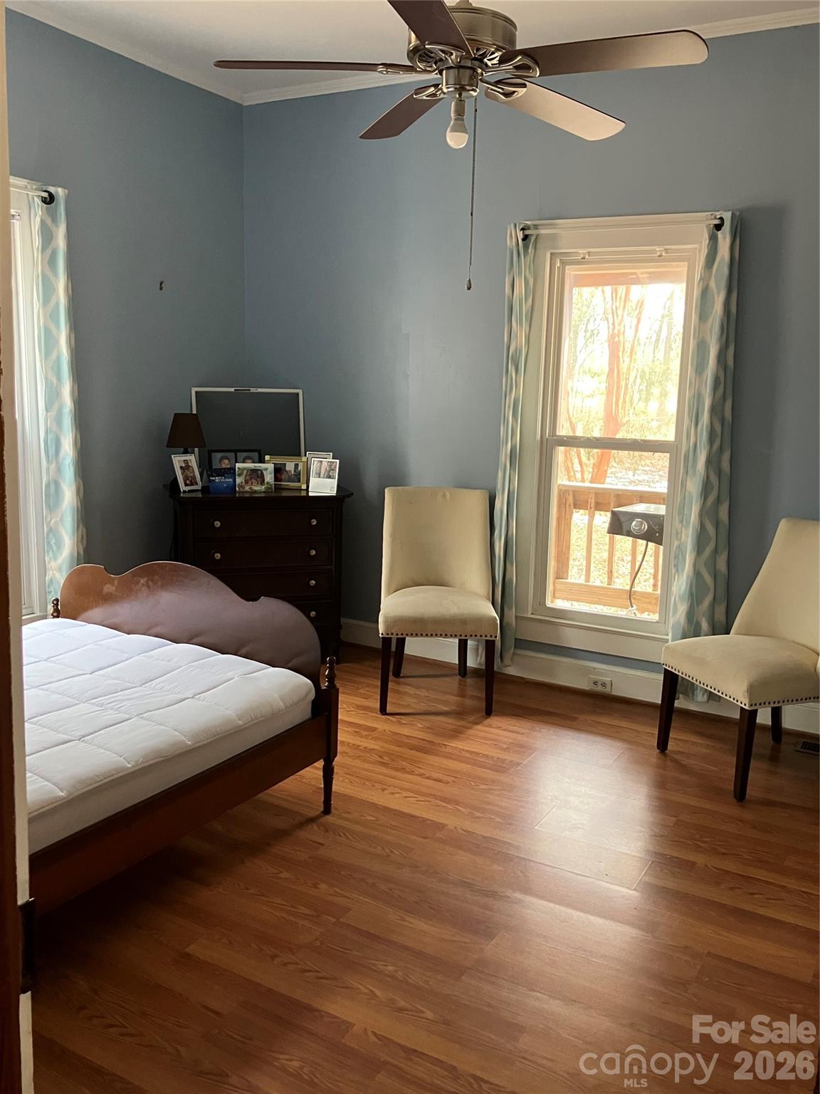 1719 Ridge Street Albemarle, NC 28001 - Photo 21 of 33 a bedroom with a bed a couch and a window