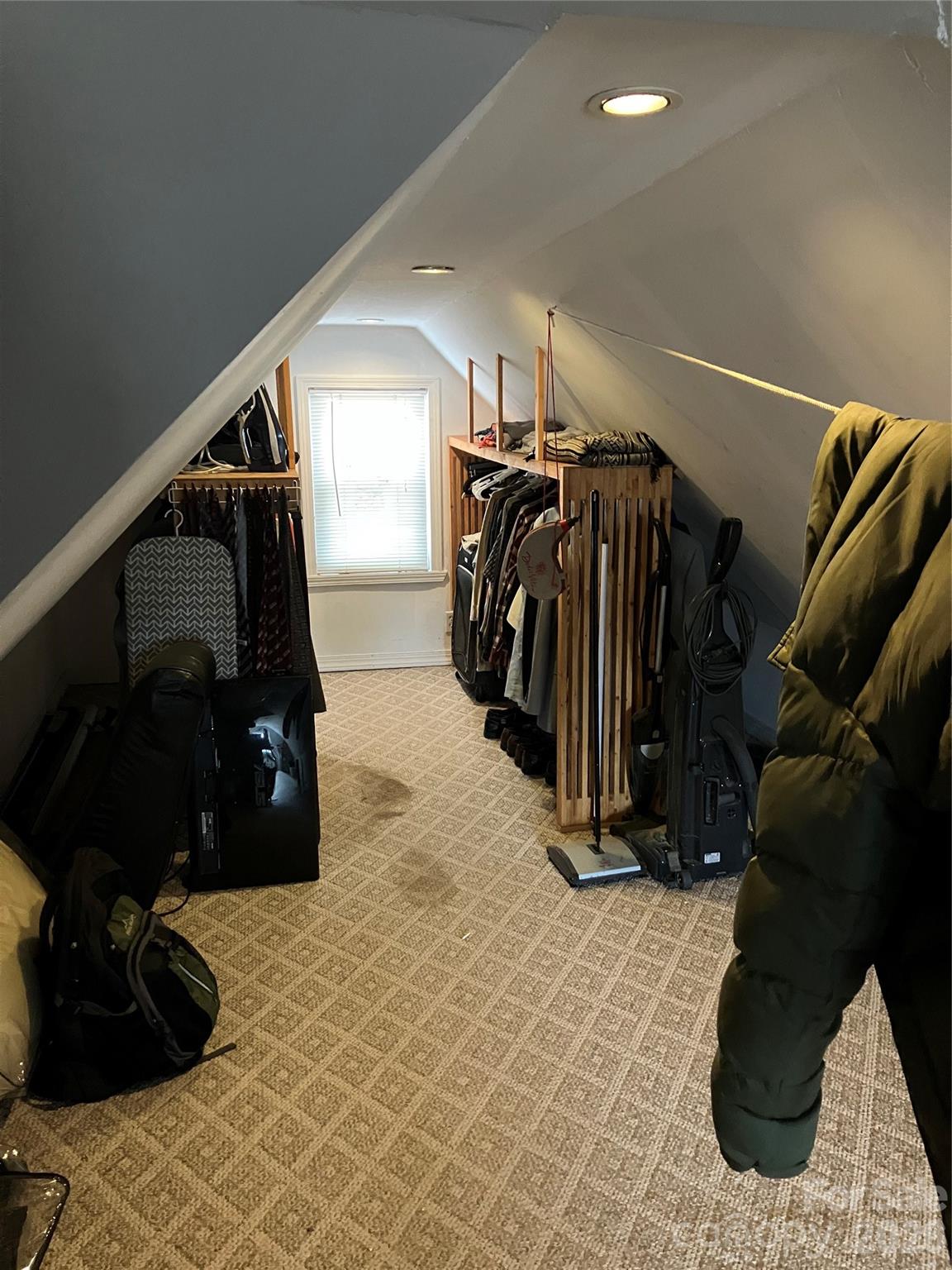 1719 Ridge Street Albemarle, NC 28001 - Photo 32 of 33 a view of walk in closet with clothes and shoes