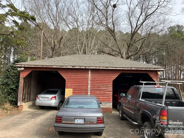 a bathroom with a granite countertop sink a toilet and a mirror