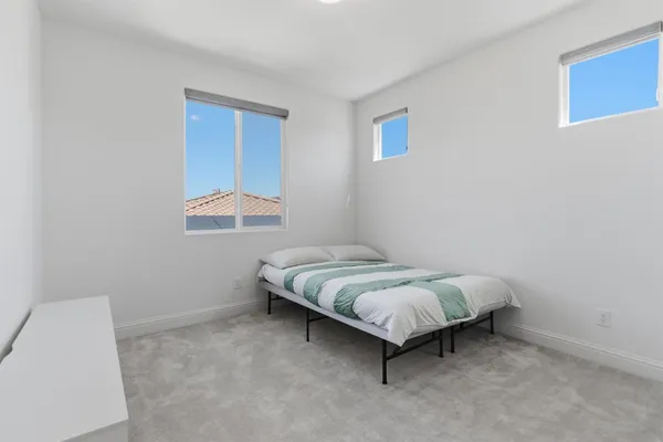 an aerial view of a residential apartment building with a yard