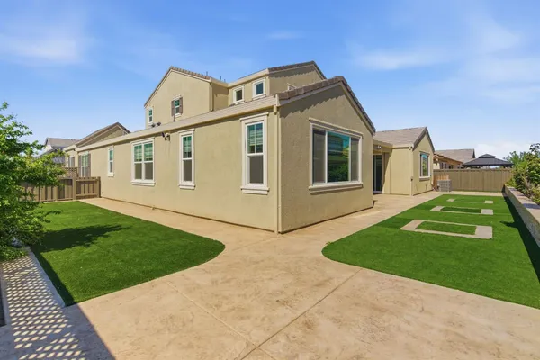 an aerial view of residential building and lake