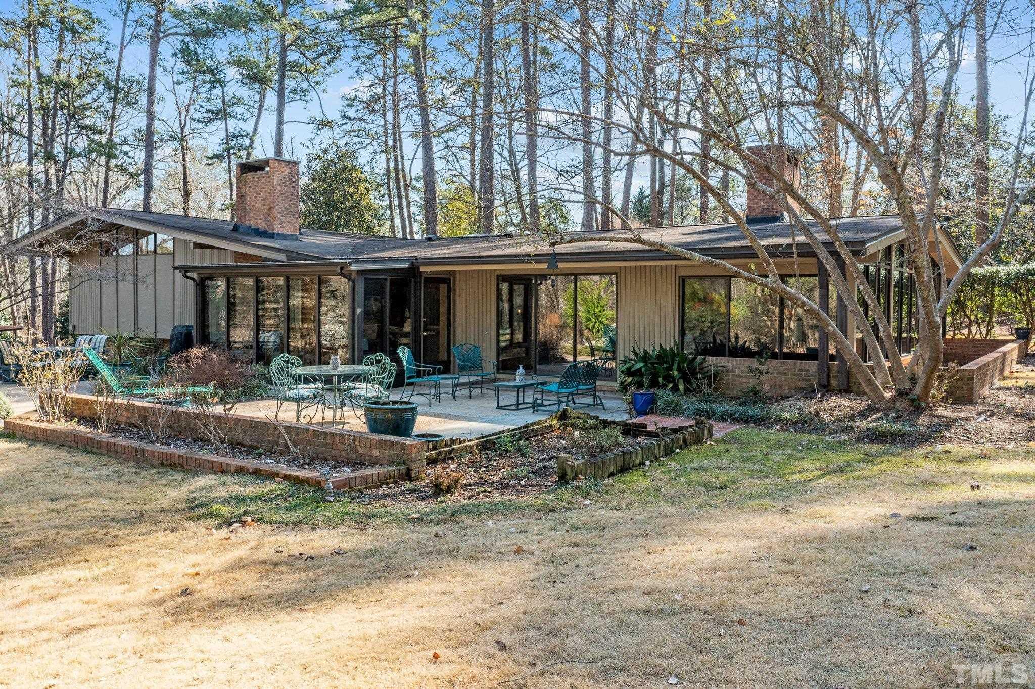 3310 Devon Road Durham, NC 27707 - Photo 1 of 50 Lovely sprawling yard embraces the patio and water feature.