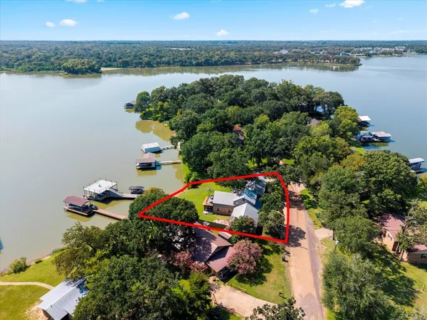 a living room with furniture large window and a fireplace