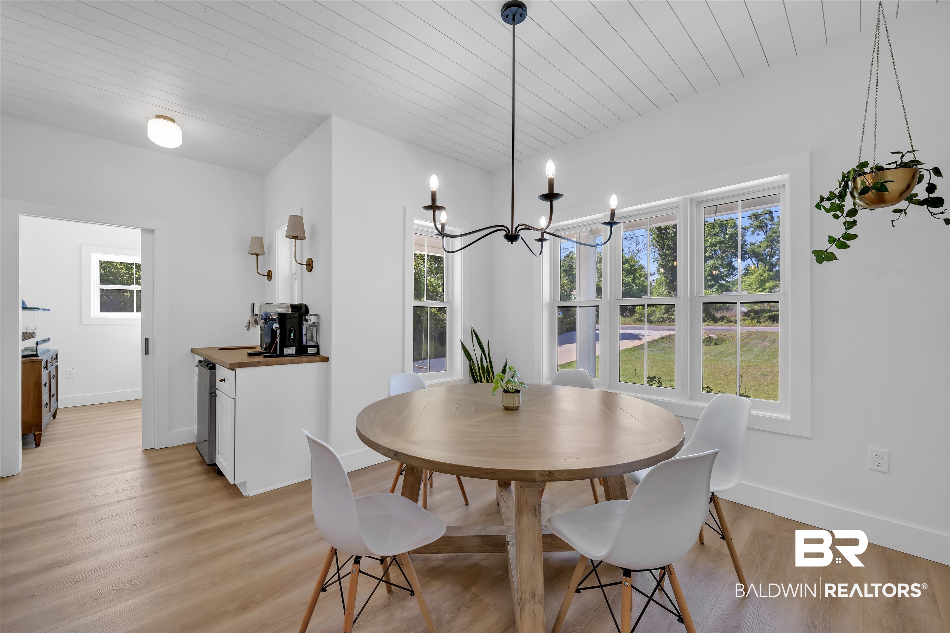 19058 James Road Gulf Shores, AL 36542 - Photo 15 of 49 Dining room featuring wood ceiling, hanging lights, and light wood-style flooring