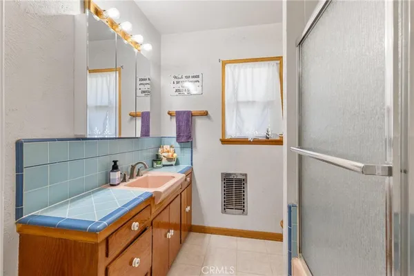 a view of a house with swimming pool and sitting area