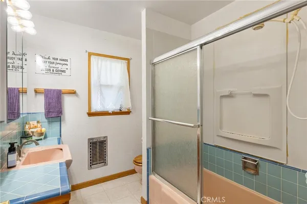 a view of a swimming pool with sitting area and furniture