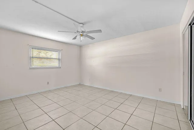 a view of an empty room and fire place