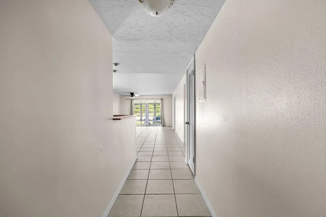 a view of a hallway with a window