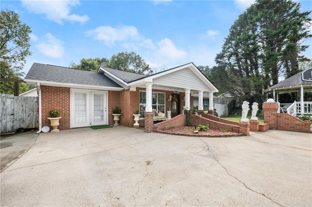 3072 Barrett Road Gainesville, GA 30507 - Photo 1 of 1 a view of a house with a yard and large tree