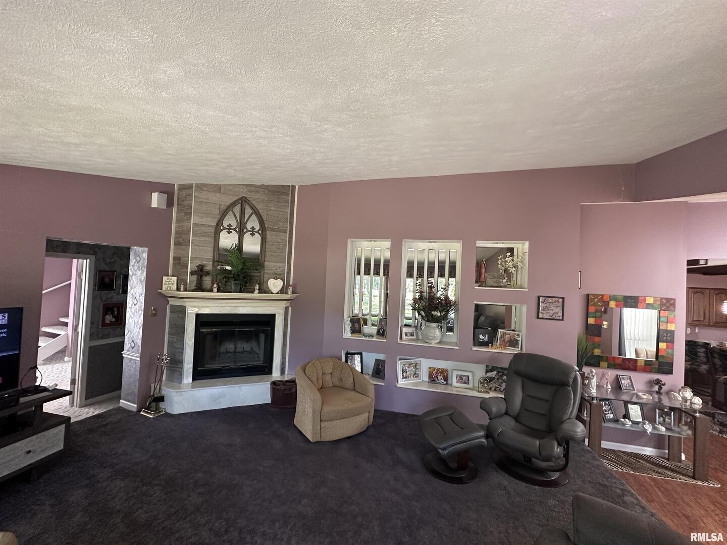 2381 Logan Street Murphysboro, IL 62966 - Photo 16 of 52 a living room with furniture and a fireplace