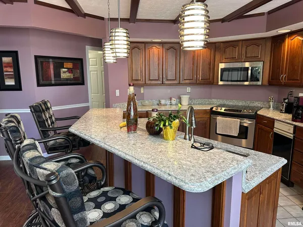 a kitchen with granite countertop lots of counter top space