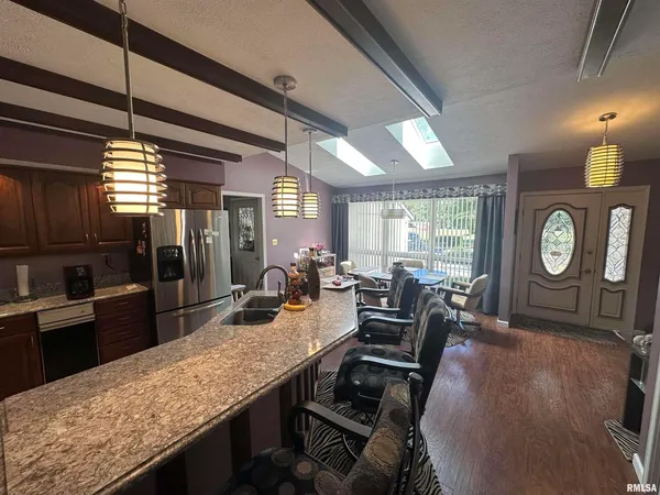 a dining room with furniture and a clock