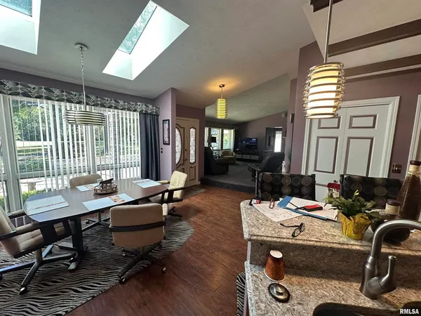 a kitchen with a stove a sink and a refrigerator