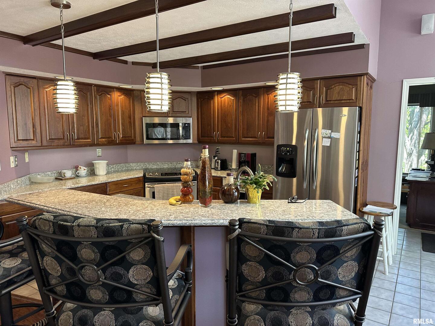 2381 Logan Street Murphysboro, IL 62966 - Photo 23 of 52 a kitchen with a dining table chairs and chairs