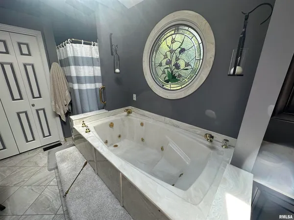 a bathroom with a bathtub and a sink