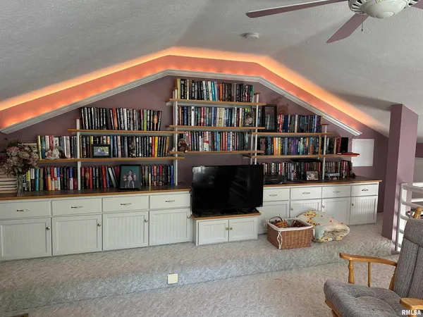 a bedroom with a bed and a mirror