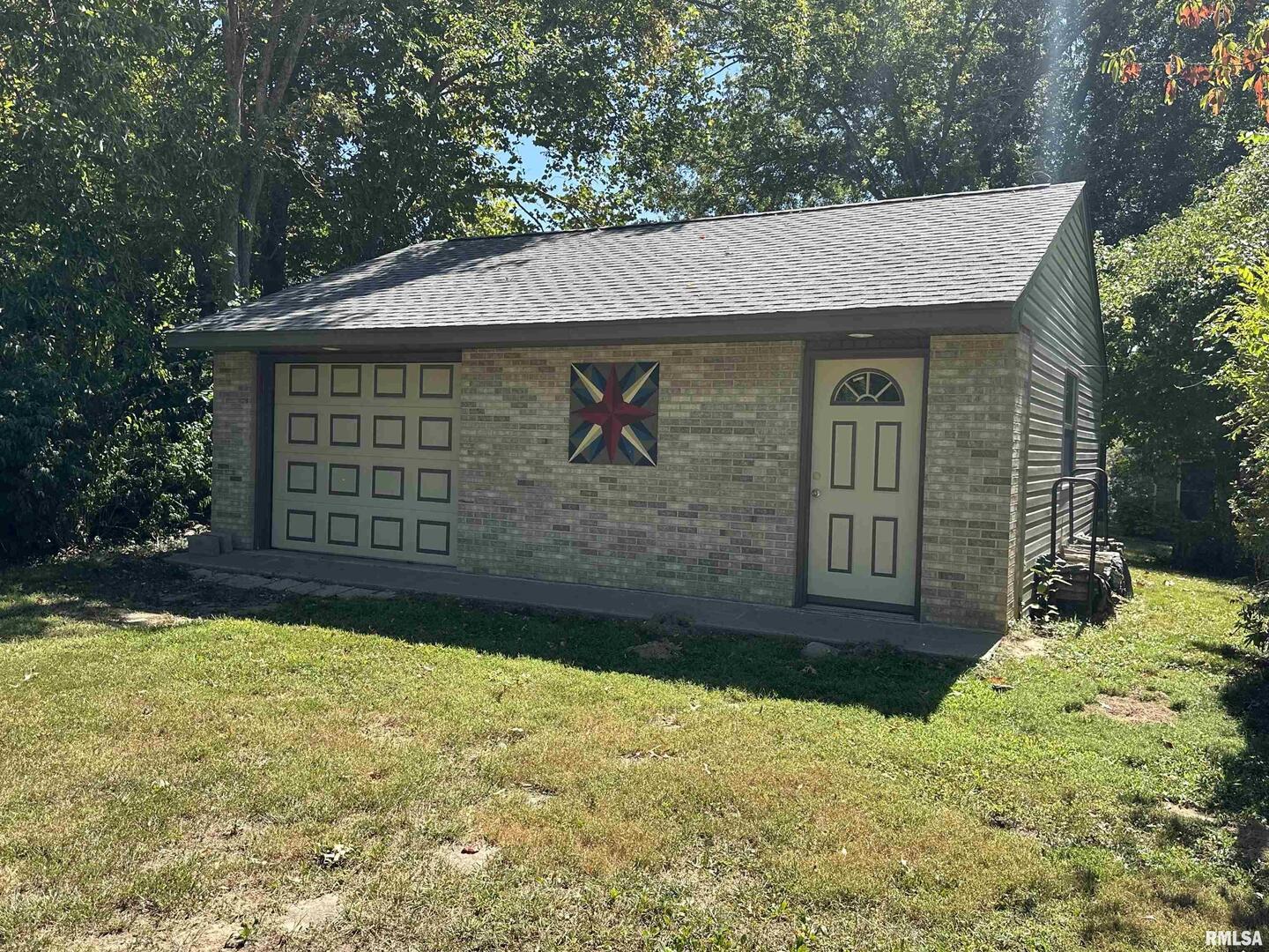 2381 Logan Street Murphysboro, IL 62966 - Photo 4 of 52 a view of a wooden house with a yard