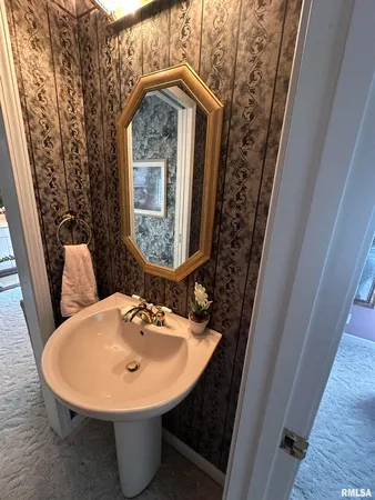 a white toilet sitting next to a shower curtain