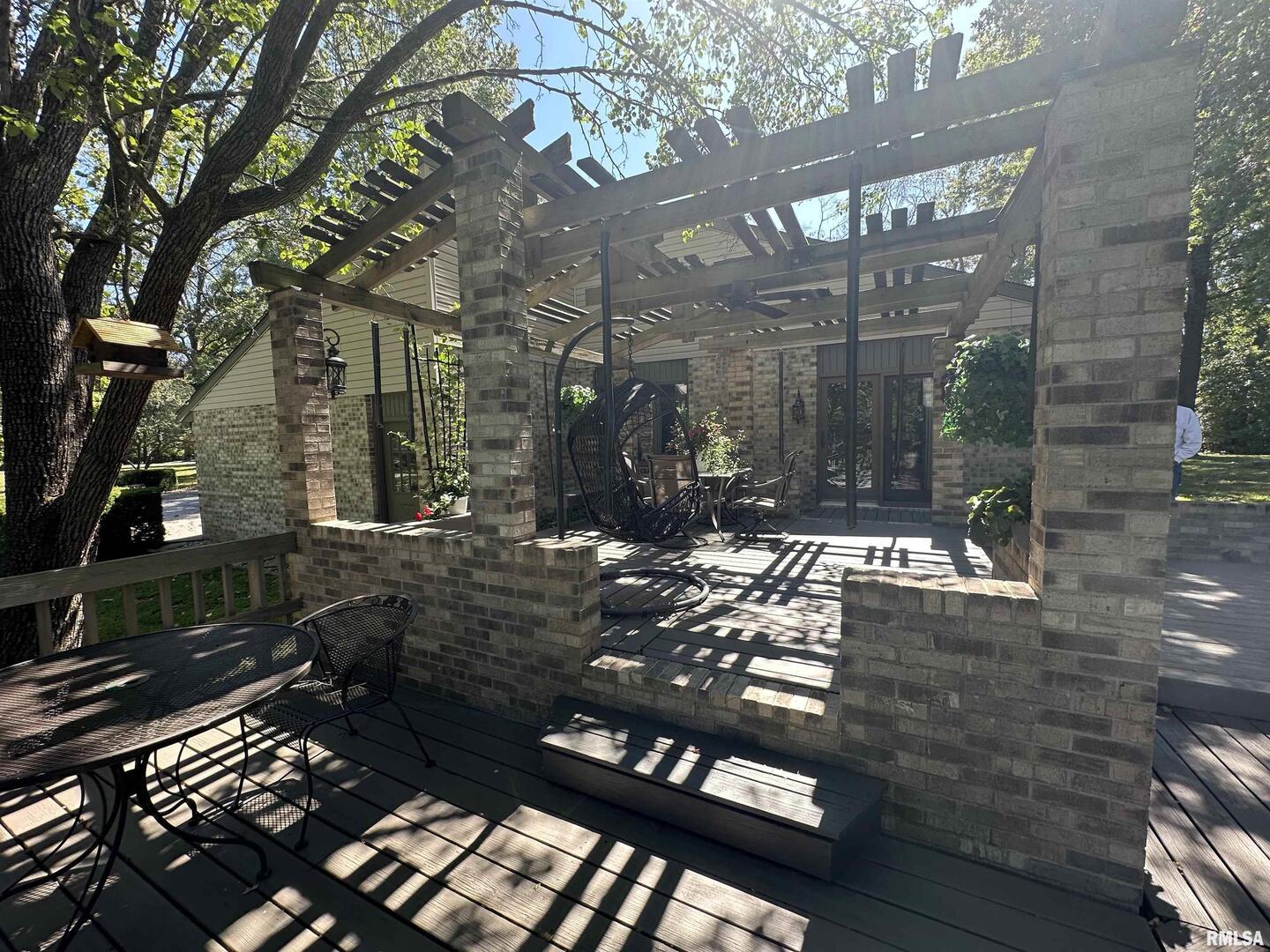 2381 Logan Street Murphysboro, IL 62966 - Photo 5 of 52 a view of a patio with table and chairs next to a yard