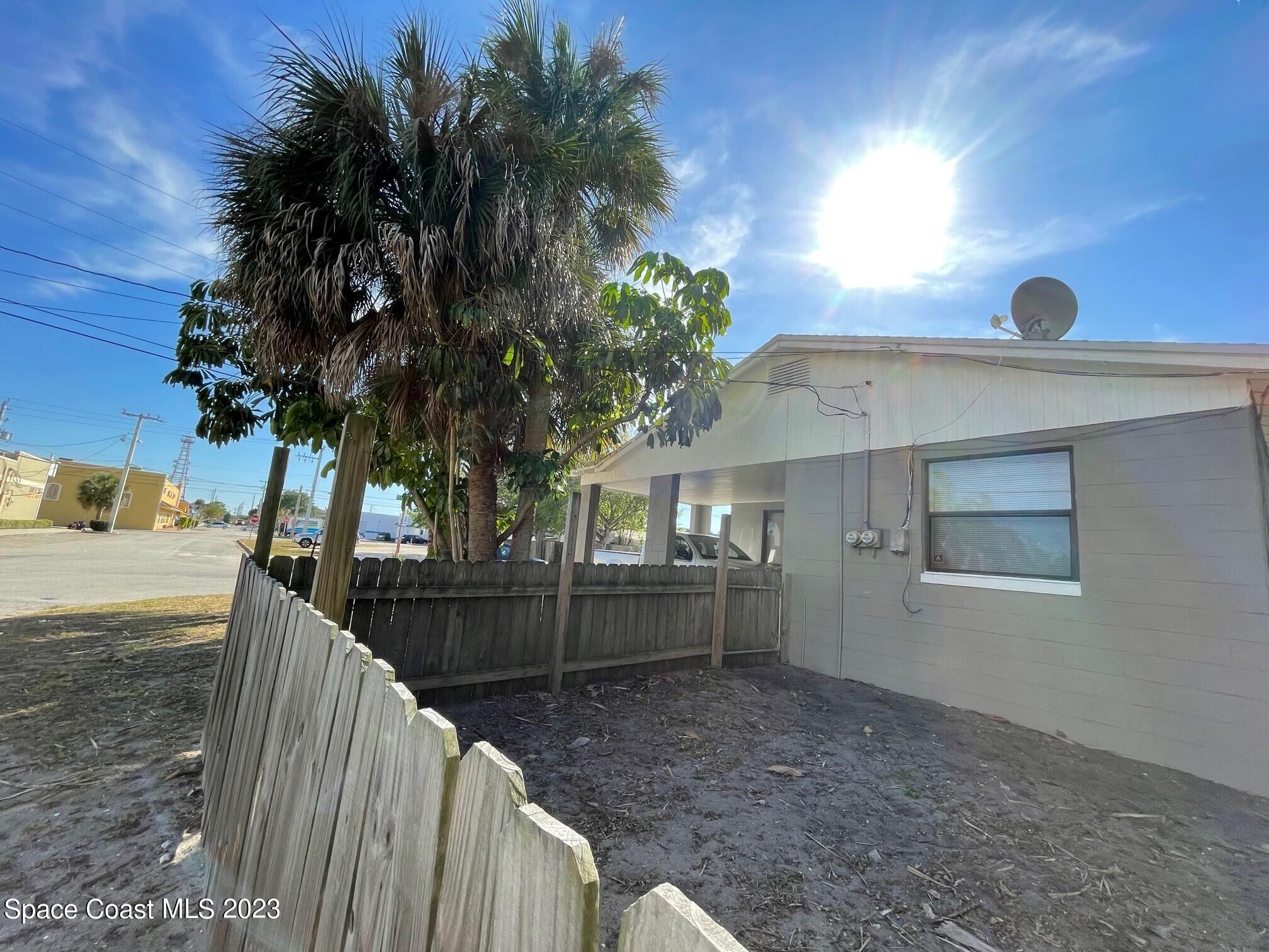 102 Center Street, Unit 102 Cocoa, FL 32922 - Photo 11 of 12 a view of a backyard and trees