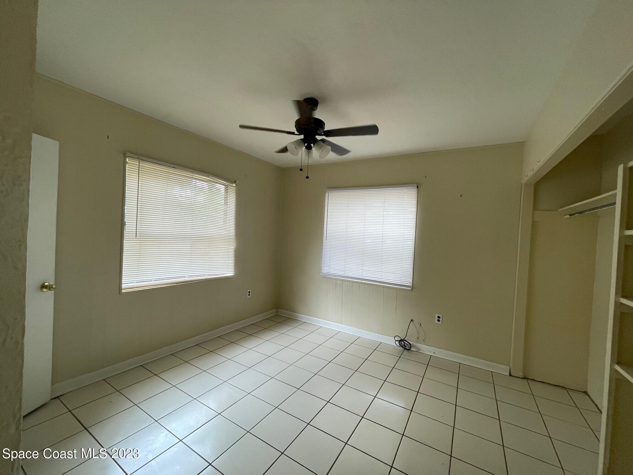 102 Center Street, Unit 102 Cocoa, FL 32922 - Photo 6 of 12 a view of an empty room and window