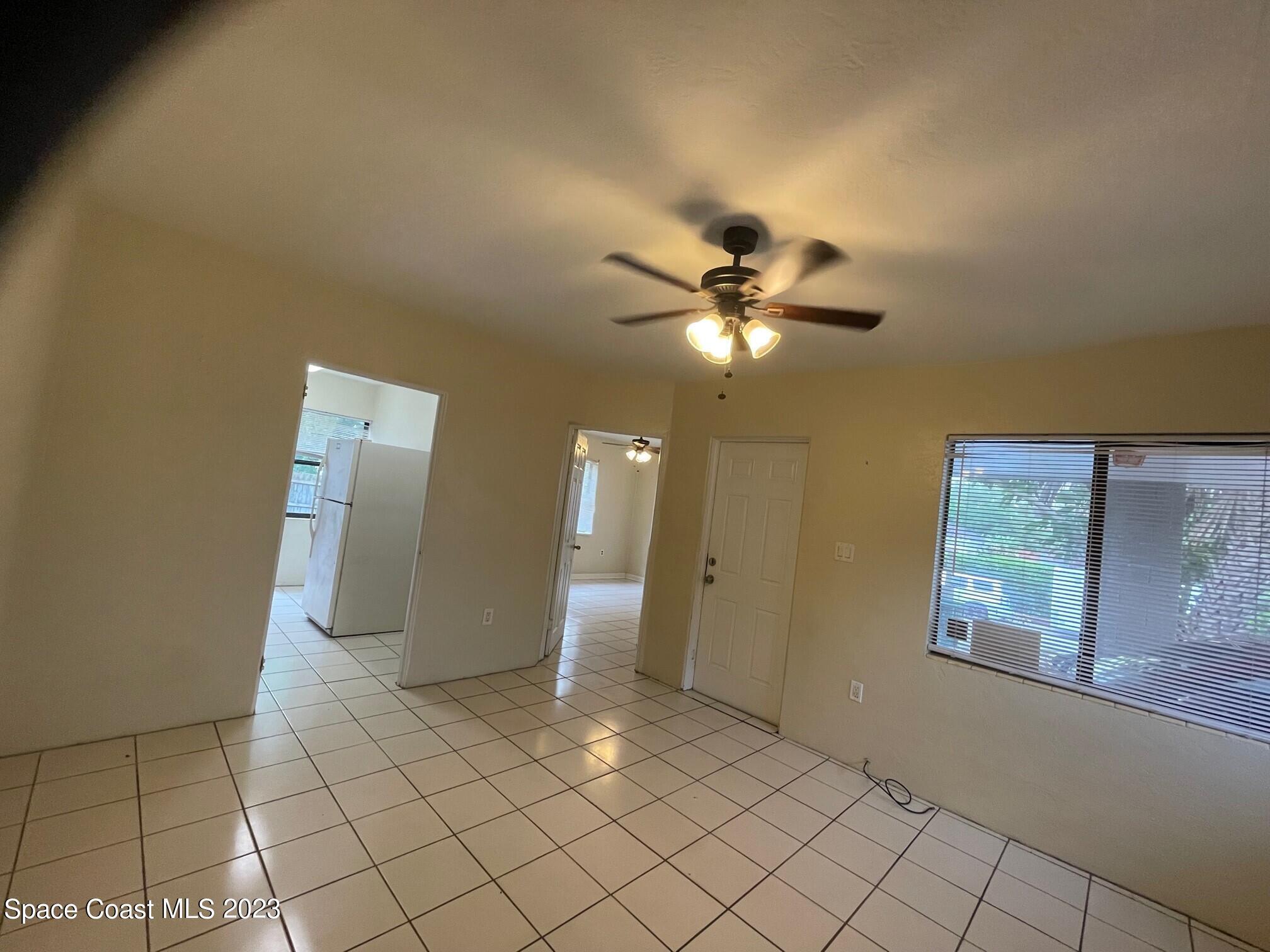 102 Center Street, Unit 102 Cocoa, FL 32922 - Photo 8 of 12 a view of a hallway with wooden floor