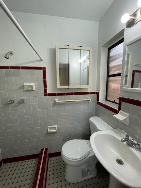 102 Center Street, Unit 102 Cocoa, FL 32922 - Photo 9 of 12 a bathroom with a sink toilet and mirror