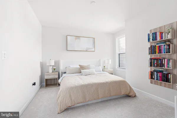 a bedroom with a bed and a book shelf