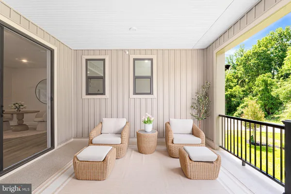 a living room with furniture and a gate