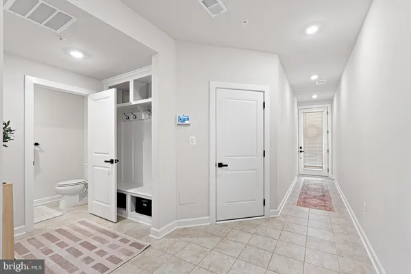 a bathroom with a toilet sink and shower
