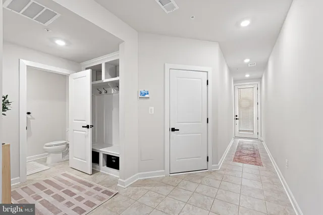 a bathroom with a toilet sink and shower