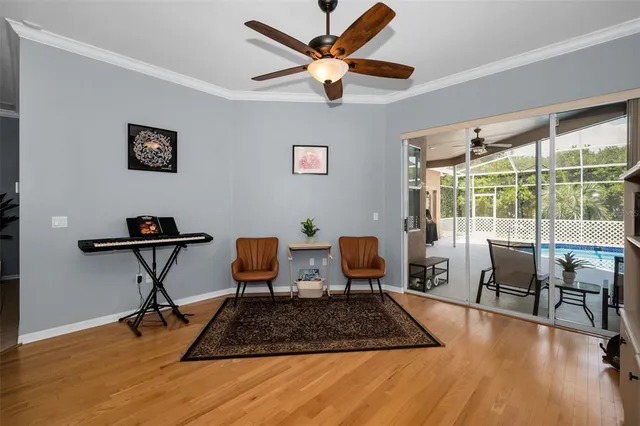 a living room with furniture and kitchen view