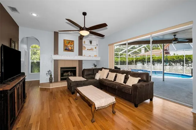 a view of a workspace with furniture and wooden floor