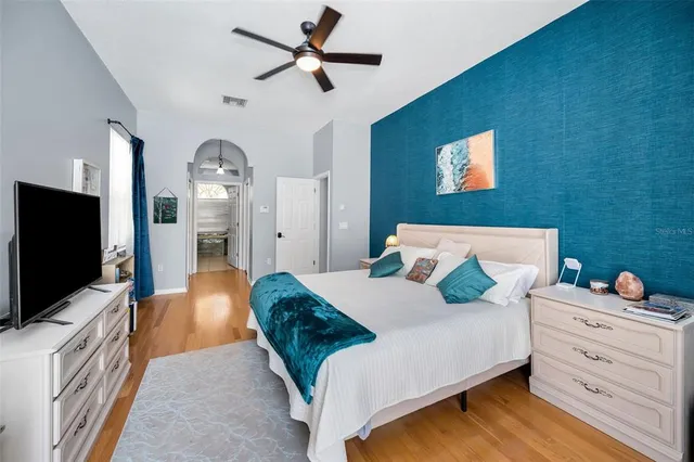 a view of a backyard with table and chairs