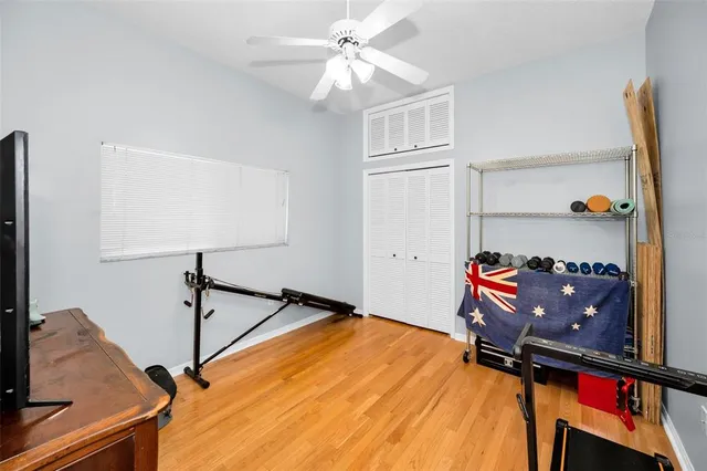 a living room with furniture fireplace and wooden floor