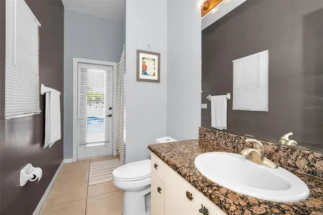 a living room with furniture a rug and a large window