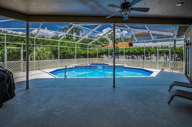 a dining room with furniture a rug and a large window