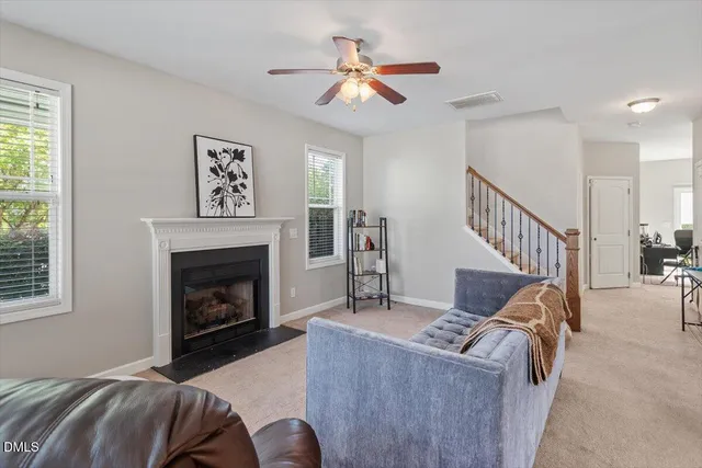 a view of a house with potted plants