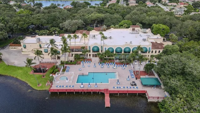 an aerial view of a house with outdoor space