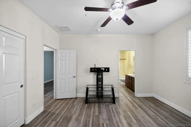 a bedroom with a bed and a closet