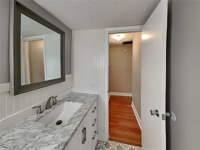 a bathroom with a sink and a mirror