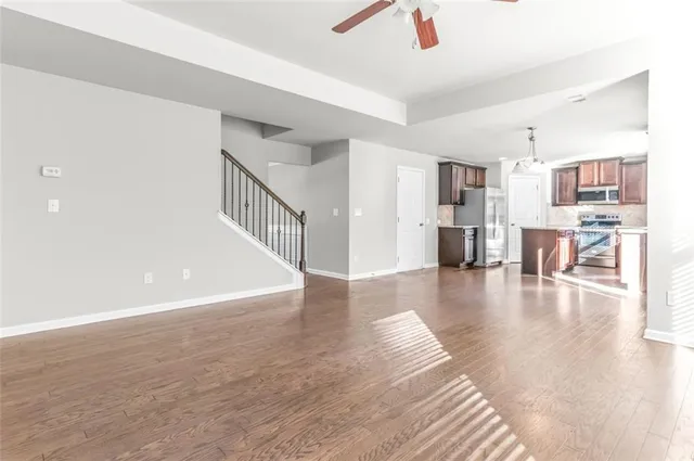 a view of livingroom with dining room and wooden floor