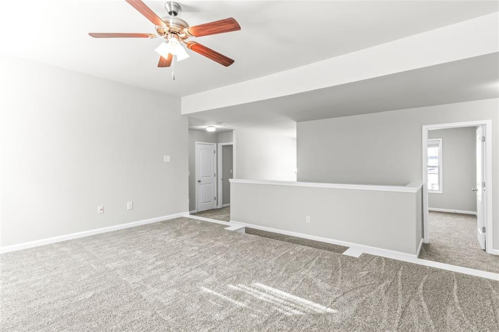 4237 Water Mill Drive Buford, GA 30519 - Photo 20 of 35 an empty room with closet and windows