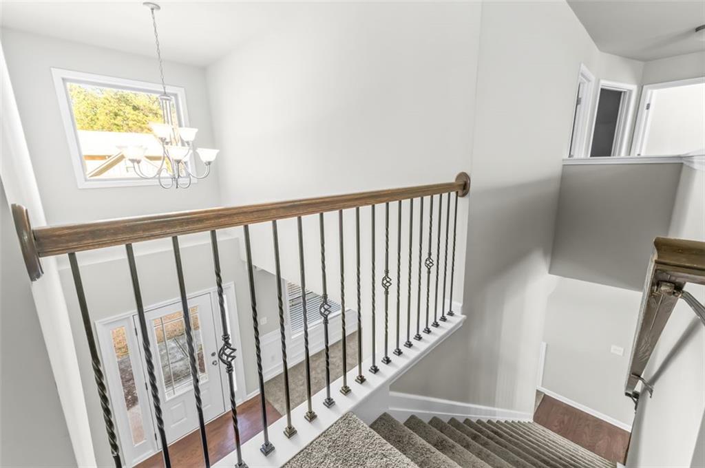 4237 Water Mill Drive Buford, GA 30519 - Photo 27 of 35 a view of hallway with wooden floor and stairs