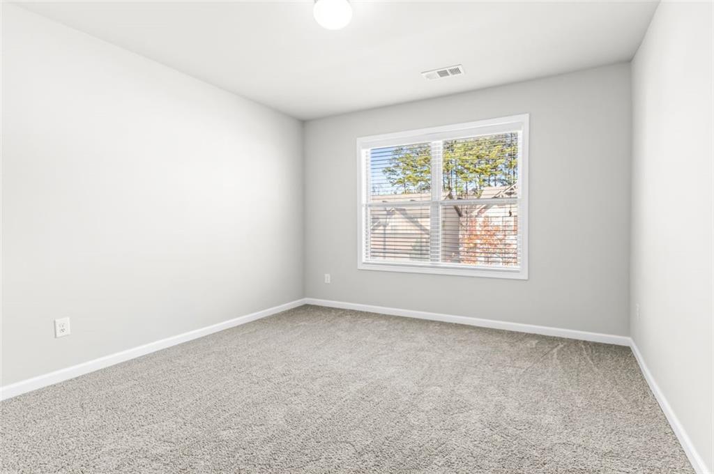 4237 Water Mill Drive Buford, GA 30519 - Photo 29 of 35 an empty room with windows