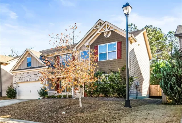 a front view of a house with a yard