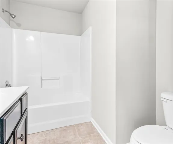 a bathroom with a toilet and a bathtub