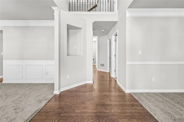 wooden floor with white walls